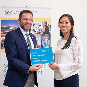Rose Yin, BME Graduate Poster winner posing with Dean Lach