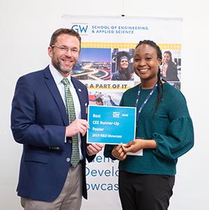 Mojolaoluwa Ladipo-Obasa posing with Dean Lach